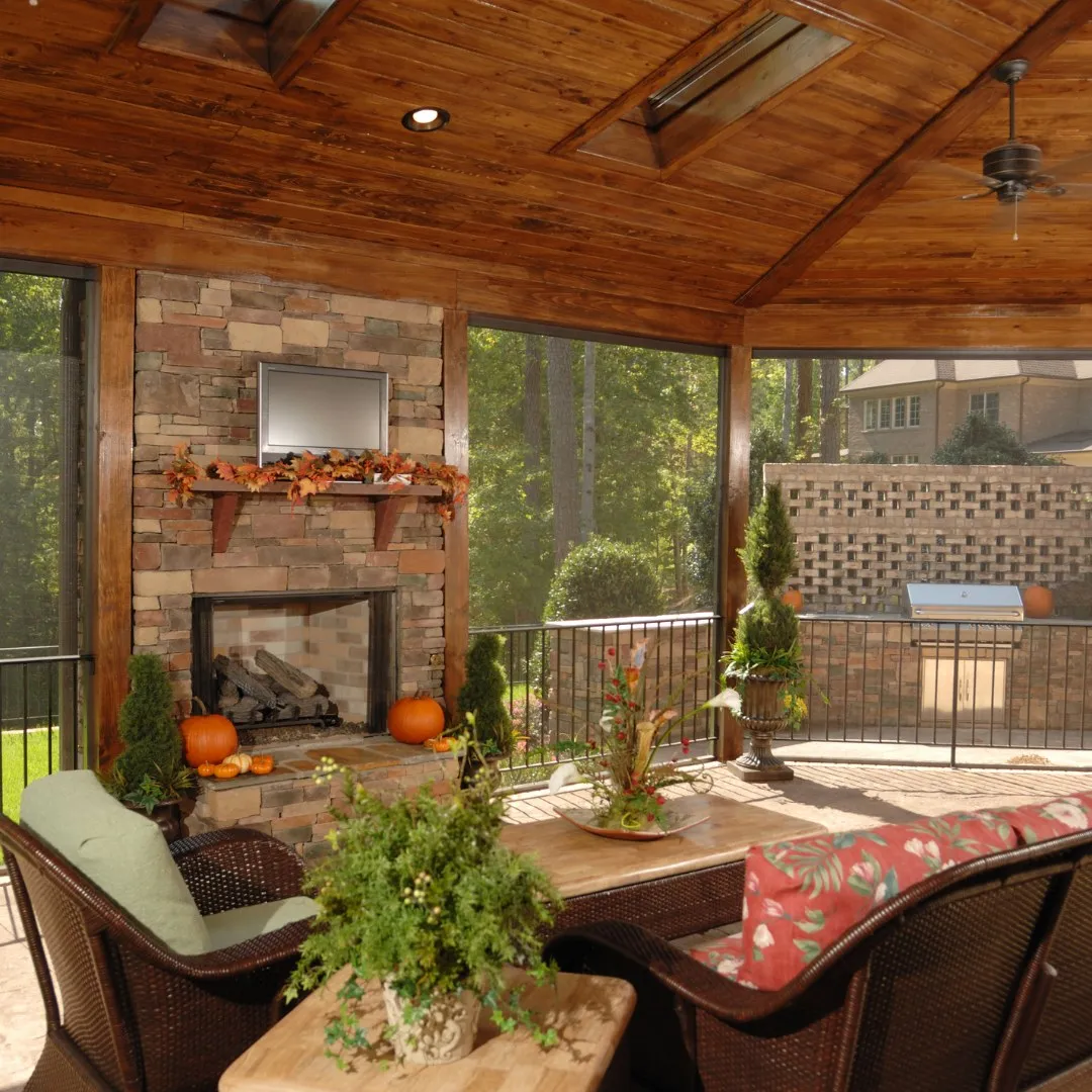 Covered patio with outdoor furniture and a fireplace