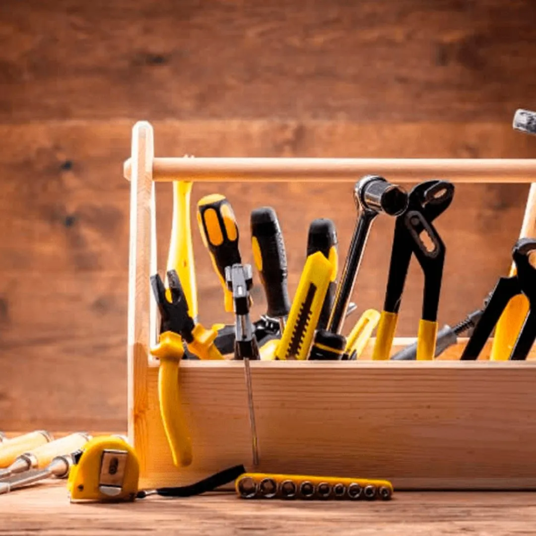 Wooden toolbox filled with hand tools